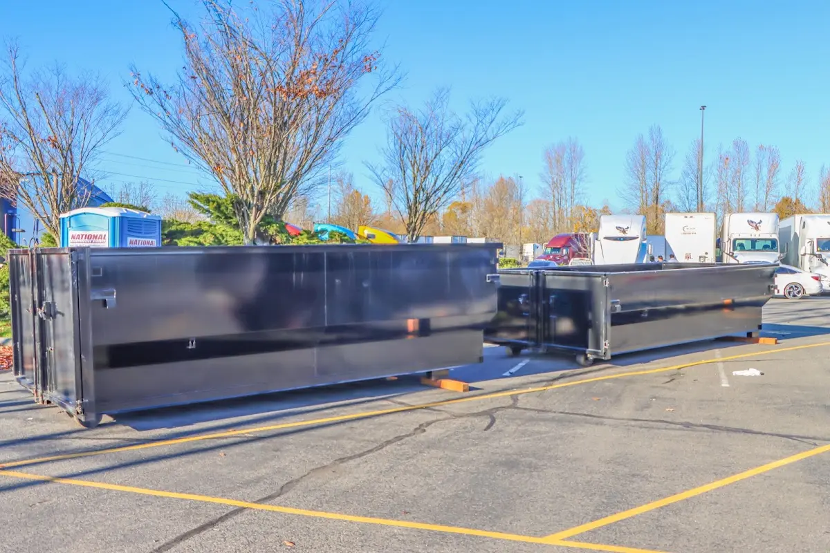 Professional dumpster rental service with roll-off container on residential driveway in Waipio Acres